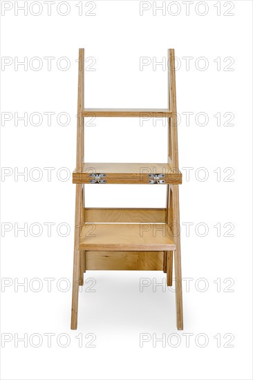 Foldable wooden chair transforming into stepladder on white background