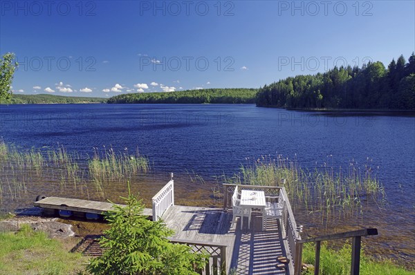 Idyllic white bench by a lake, bathing opportunity, Dalsland Canal, Bengtfors, Dalsland, Västra