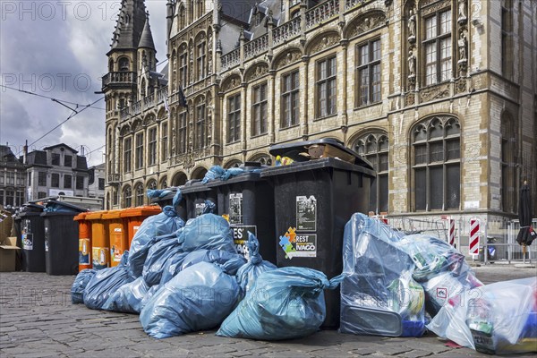 Rubbish bags and garbage containers with piled up household refuse due to strike by the waste
