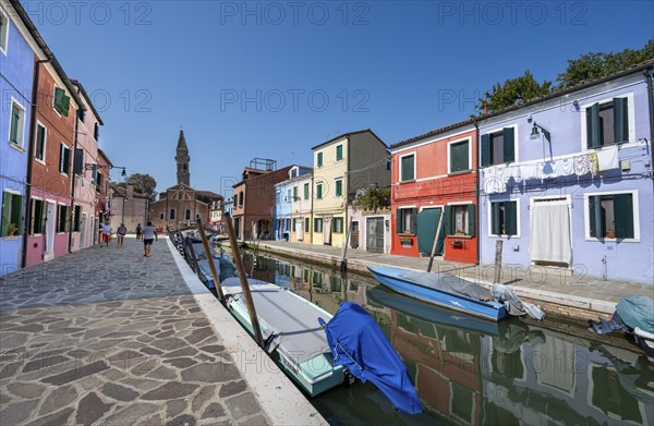 Colourful houses on the canal with reflection, canal with boats and colourful house facades, in the