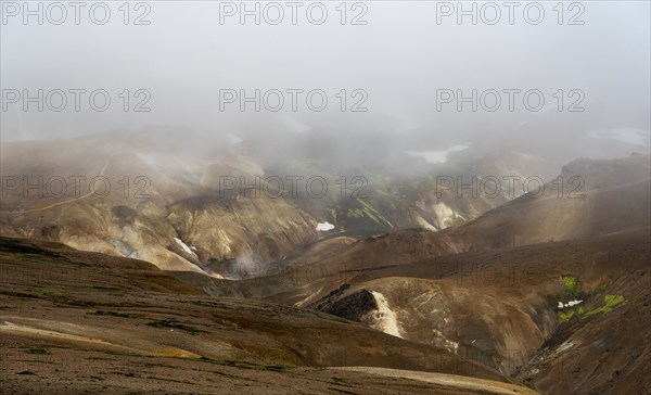 Cloudy colourful rhyolite mountains, geothermal area Hveradalir, Kerlingarfjöll, Icelandic