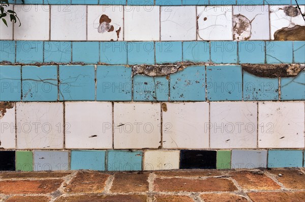 Broken wall in a swimming pool, cracks, wall tiles, dilapidated swimming pool, lost place, full