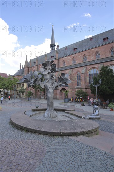 Fountain of Paradise by Gernot Rumpf 1973 at the Kartoffelmarkt with baroque collegiate church St.