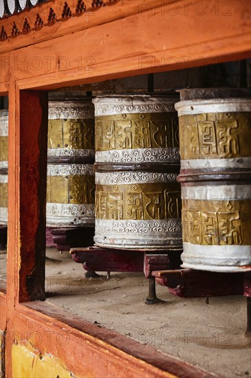 Buddhist prayer wheels in Hemis gompa (Tibetan buddhist monstery) . Ladakh, India, Asia