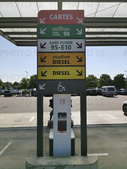 Petrol station, sign indicating the different types of fuel, at a motorway service station on the