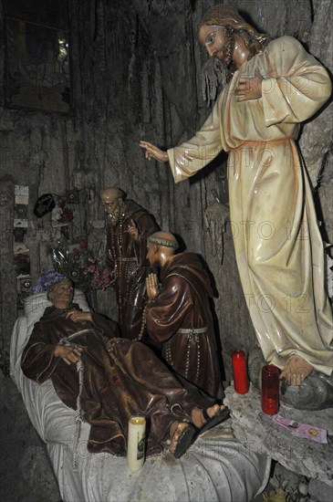 Interior of the Grotto of St Anthony of Padua, Saint-Antoine de Padoue showing praying monks at