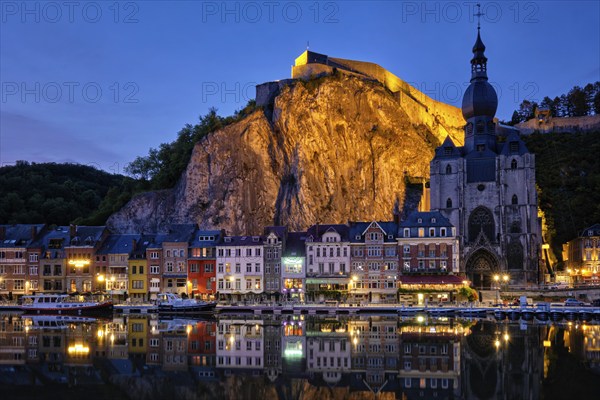 Night view of Dinant town, Collegiate Church of Notre Dame de Dinant over River Meuse and Pont