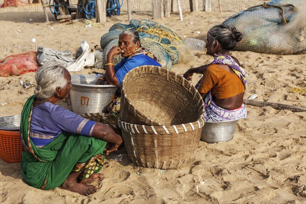 CHENNAI, INDIA, FEBRUARY 10, 2013: Local Indian women on Marina beach in Chennai. Marina beach is