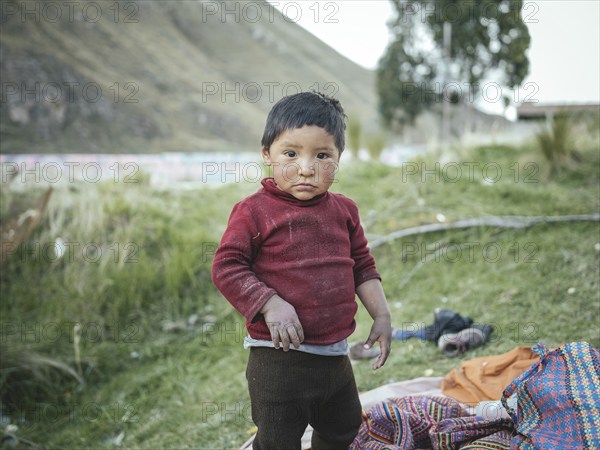 Child of a miner in an open pit kaolin mine, Pachacayo, Peru, South America