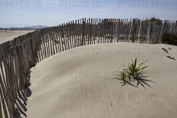 Protective fence to prevent erosion on the beach at Frontignan, Hérault, Occitania, France, Europe