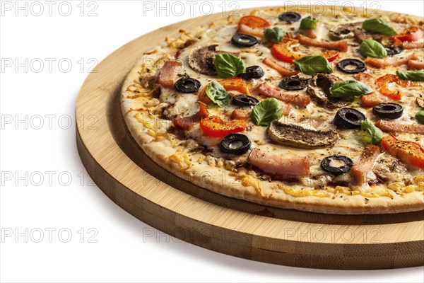 Ham pizza with (capsicum), mushrooms, olives and basil leaves isolated on white