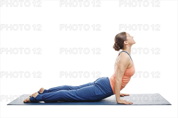 Woman doing Surya Namaskar Sun Salutation Ashtanga Vinyasa Yoga asana Urdhva mukha (Urhdvamukha)