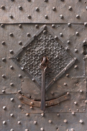 Old door knocker on the front door of the former Palazzo Pinelli Parodi in the historic centre,