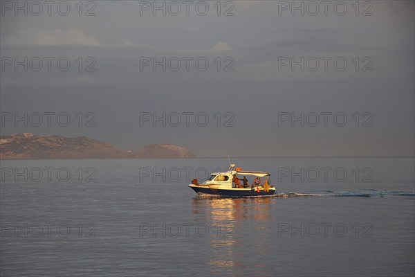 Morning light, cloudy sky, fishing boat, harbour, Heraklion, capital, island of Crete, Greece,