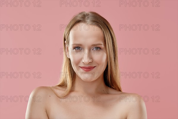 Beautiful smiling girl looking straight forward