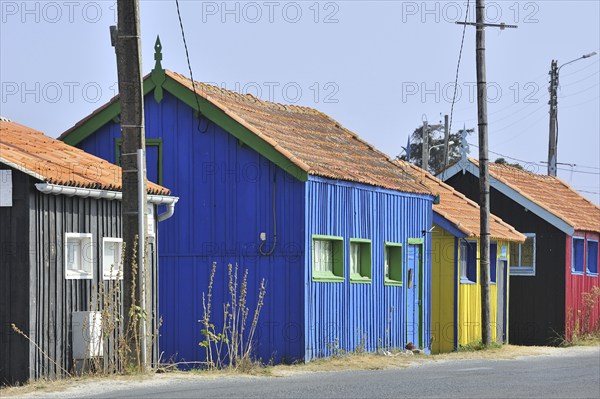 Colourful cabins of oyster farm at la Baudissière near Dolus, Saint-Pierre-d'Oléron on the island