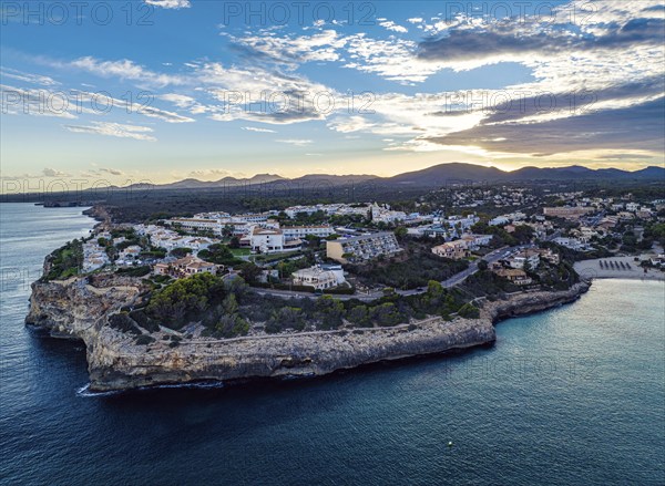 Sunset over Cala Anguila-Cala Mendia from a drone, Porto Cristo, Majorca, Spain, Europe