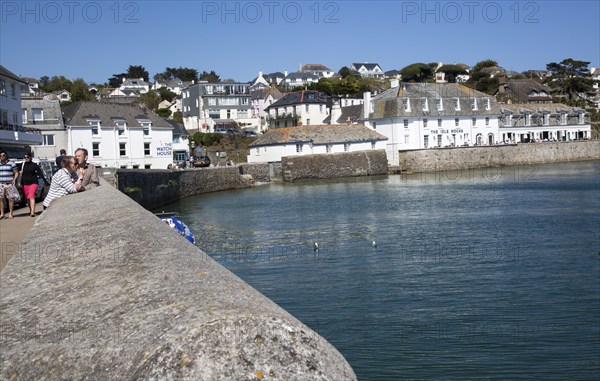 Village buildings and harbour wall, St Mawes, Cornwall, England, UK