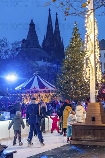 Ice rink at the Christmas market on the Heumarkt in the old town of Cologne, Cologne Cathedral,