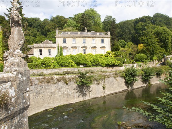 Statue of Britannia on the fifteenth century bridge over the River Frome, Iford Manor, near