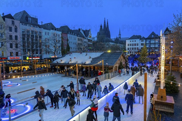 Ice rink at the Christmas market on the Heumarkt in the old town of Cologne, Cologne Cathedral,