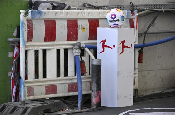 Adidas Derbystar match ball on platform, Bundesliga logo, MHPArena construction site, MHP Arena