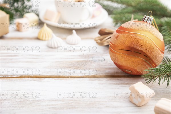 Christmas or New Year composition. Decorations, box, balls, cinnamon, fir and spruce branches, cup
