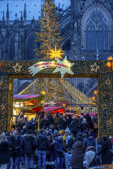 Christmas market at Roncalli Platz am Dom, in the city centre of Cologne, Sunday shopping in
