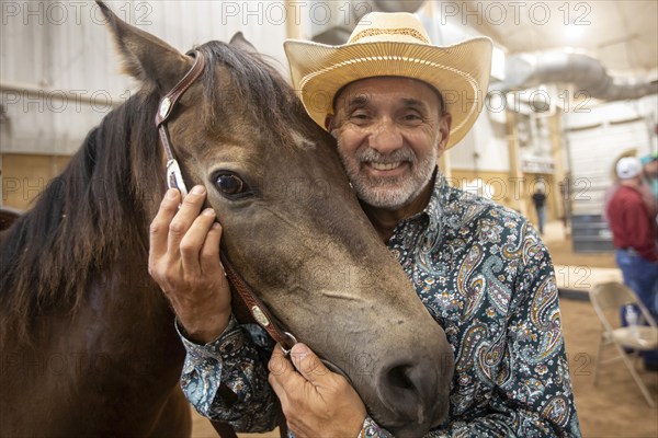Oklahoma City, Oklahoma, A competitor with his horse at the Great Plains Rodeo, an annual gay rodeo