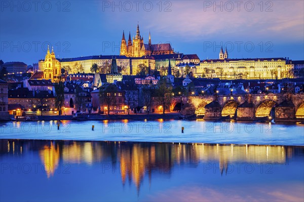 Travel Prague Europe concept background, view of Charles Bridge and Prague Castle in twilight.