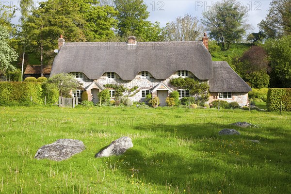 Two historic semi-detached thatched cottages at Lockeridge village, Wiltshire, England, United
