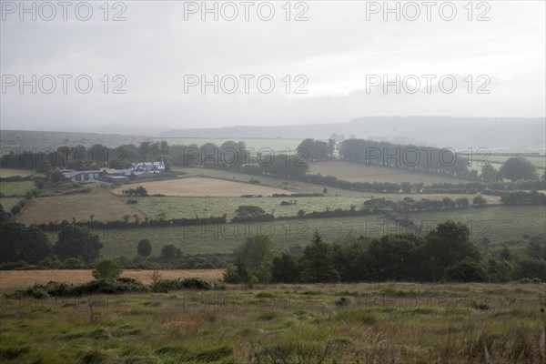 Grey overcast weather clouds hanging over moorland, Dartmoor national park, near Postbridge, Devon,