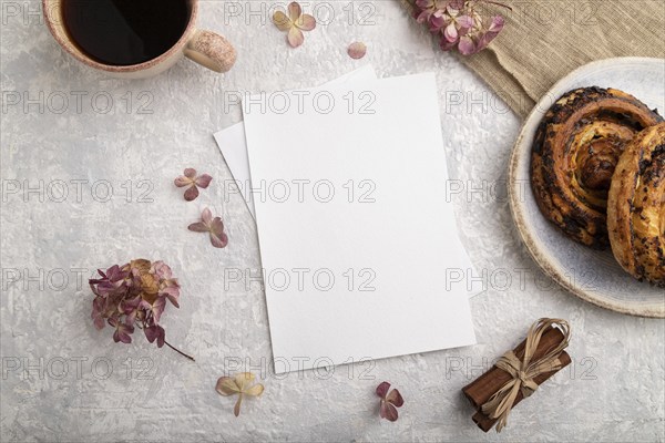White paper invitation card, mockup with hydrangea flowers, bun, cup of coffee, linen textile,