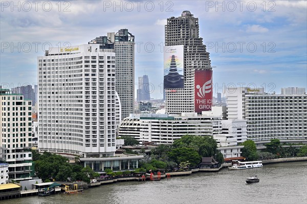 Shangri-La Hotel and Sathorn Unique Tower with iphone advert, Bangkok, Thailand, Asia
