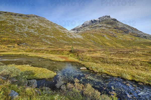 Autumn in Reinheimen National Park, mountains with river in Valldalen valley, Møre og Romsdal,