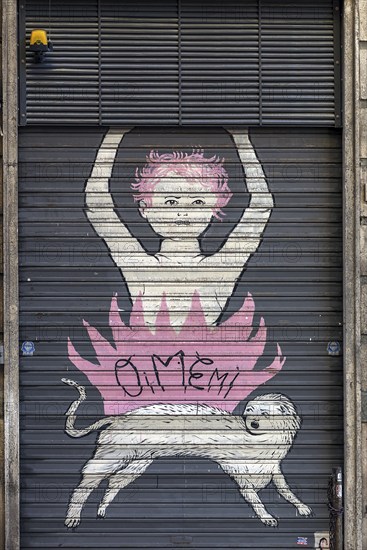 Graffiti on a closed shutter in the historic centre, Genoa, Italy, Europe