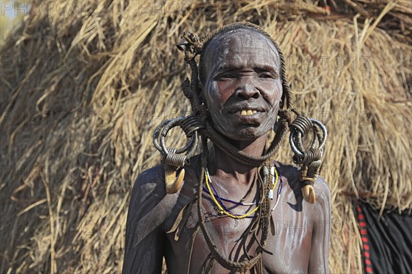 South Ethiopia, in the Maco National Park, Mursi tribe, older Mursi woman with naked upper body and