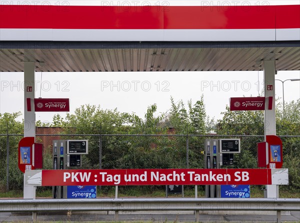 Self-service petrol station for cars, open 24 hours a day, around the clock, on the border between