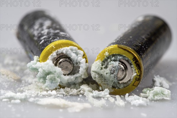 Leaked batteries, AA batteries, oxidised, leaked potassium carbonate and ammonium chloride