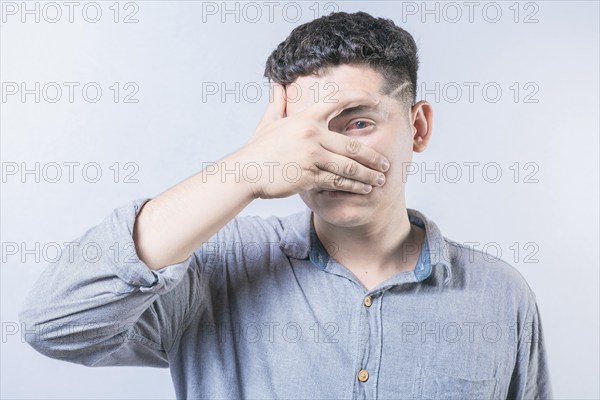 Young person with irritated eyes. People with conjunctivitis covering eye isolated. Man with eye