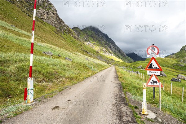 Mountain road from Haukland beach to Uttakleiv, warning signs, no public traffic, be aware of sheep