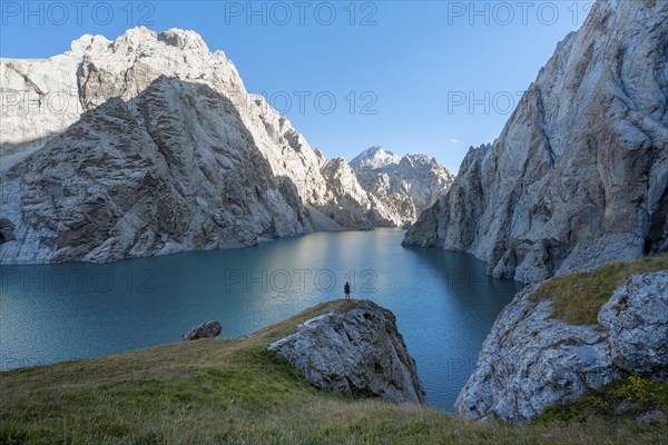 Hiker in front of Kol Suu Mountain Lake, Kol Suu Lake, Sary Beles Mountains, Naryn Province,