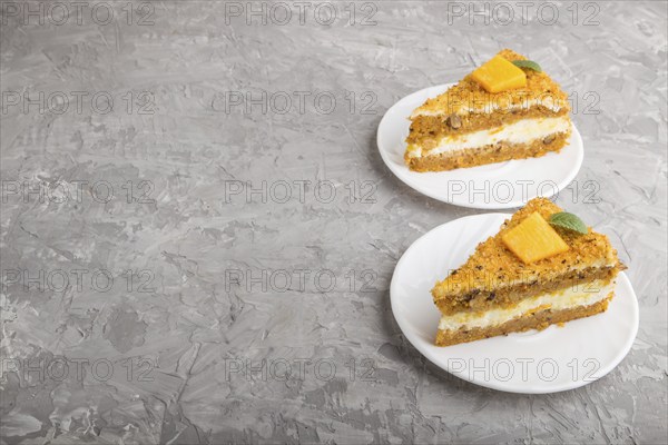 Homemade cake with persimmon and pumpkin on a gray concrete background. side view, close up, copy