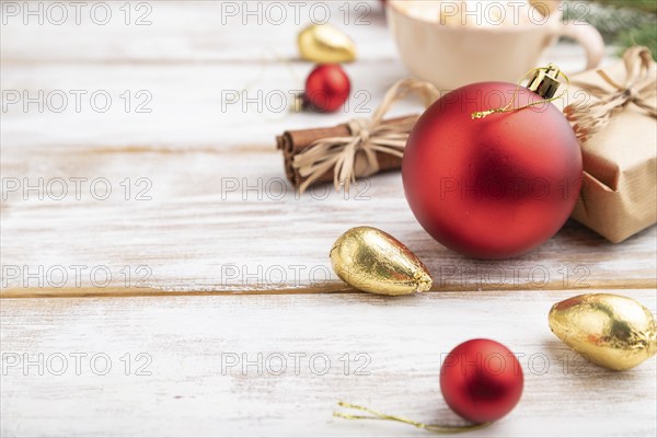 Christmas or New Year composition. Decorations, box, red balls, cinnamon, fir and spruce branches,
