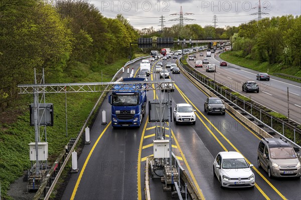 Weighing and barrier system on the A42 motorway, in front of the dilapidated motorway bridge over