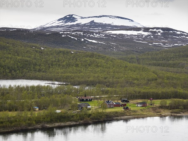 Tana or Tanaelva River, view of small settlement over the river in Norway, which forms the border