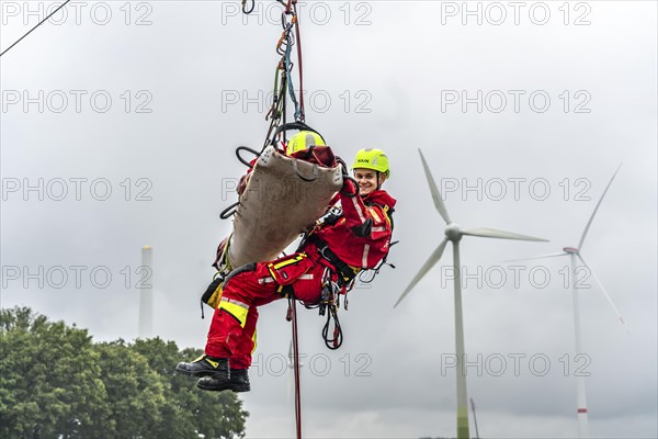 Height rescuers from the Oberhausen professional fire brigade practise abseiling from a wind