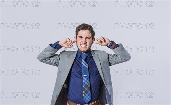 Man covering his ears isolated, guy covering his ears on isolated background, man with hands on his
