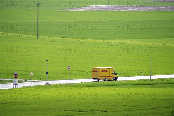 B519 country road near Flörsheim, DHL parcel service van, Hesse, Germany, Europe
