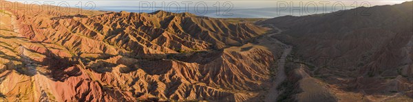 Aerial view, eroded mountain landscape, sandstone cliffs, canyon with red and orange rock